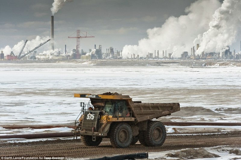 A massive truck delivers a load of oil sands for processing. Oil sand is considered the energy source of the future.