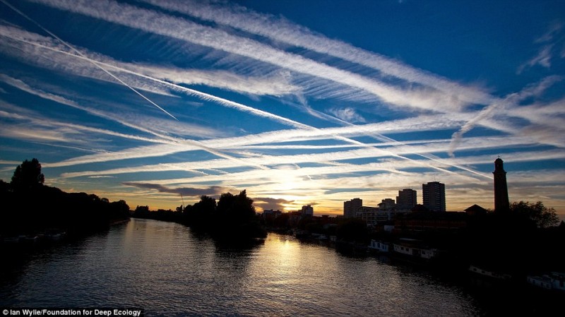 Trails of excessive air traffic over London.