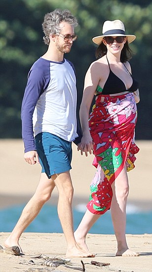 *PREMIUM EXCLUSIVE RATES APPLY* *NO WEB UNTIL 8.30AM PST, JANUARY 5. NO NY PAPERS*A bikini clad Anne Hathaway shows off her growing baby bump while SPENDING CHRISTMAS AND NEW YEAR with her husband Adam Shulman in Hawaii. Shot on Dec 27