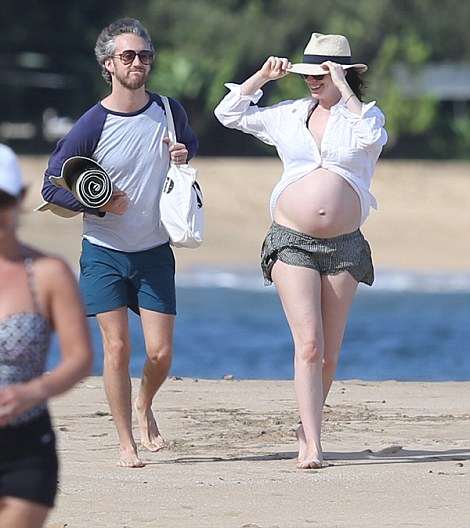 *PREMIUM EXCLUSIVE RATES APPLY* *NO WEB UNTIL 8.30AM PST, JANUARY 5. NO NY PAPERS*A bikini clad Anne Hathaway shows off her growing baby bump while SPENDING CHRISTMAS AND NEW YEAR with her husband Adam Shulman in Hawaii. Shot on Dec 27