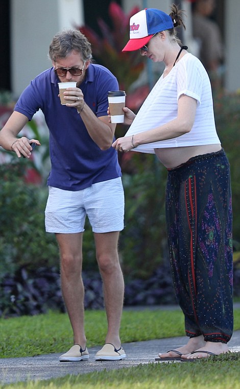 *PREMIUM EXCLUSIVE RATES APPLY* *NO WEB UNTIL 8.30AM PST, JANUARY 5. NO NY PAPERS**A pregnant Anne Hathaway shows off her growing baby bump in a white crop top while SPENDING CHRISTMAS AND NEW YEAR in Hawaii. Shot on Dec 28