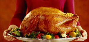 Woman with roast turkey